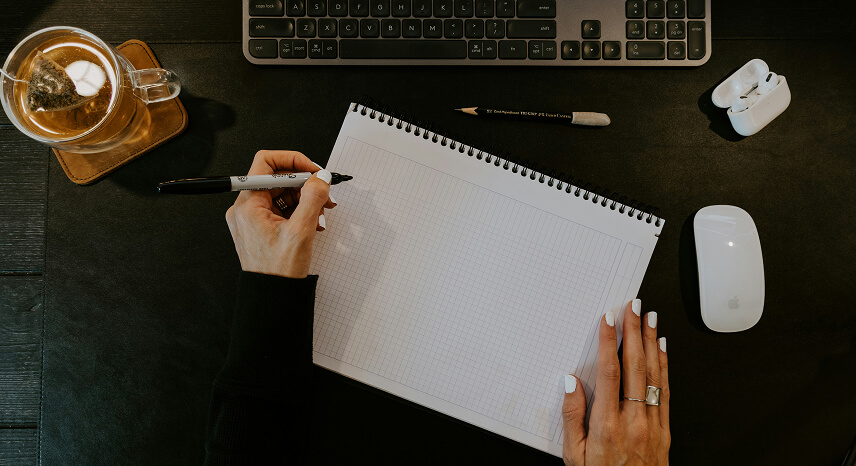 Scripting and curriculum planning at a production desk